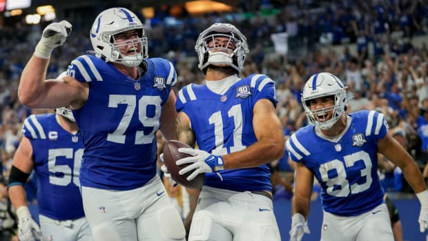 Indianapolis Colts offensive tackle Bernhard Raimann (79) and Indianapolis Colts tight end Kylen Granson (83) celebrate with Indianapolis Colts wide receiver Michael Pittman Jr. (11) after a touchdown Sunday, Sept. 10, 2023, during a game against the Jacksonville Jaguars at Lucas Oil Stadium in Indianapolis.  
